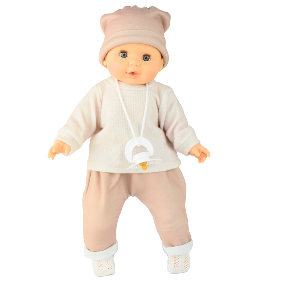 Puppe mit blauen Augen und rosafarbener Kleidung und Schnuller