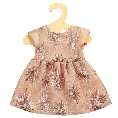 Das Kleid ist rosa und hat Pailletten drauf