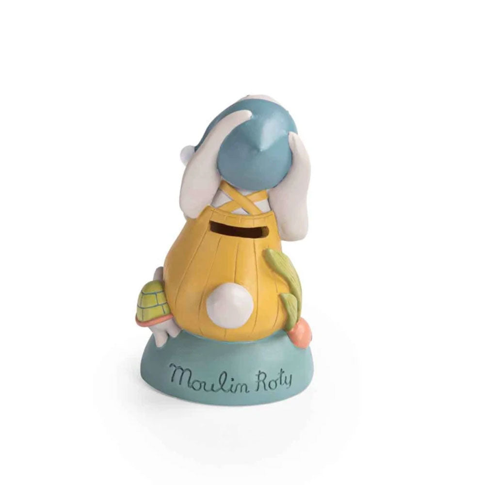 Auf der Rückseite befindet sich der Schlitz zum Einwerfen der Geldmünzen und Scheine. Auf dem Stein steht der Markenname Moulin Roty