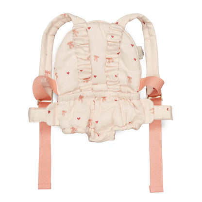 Süße Puppentrage in einem zarten rosa mit Schleifchen und Herzchen drauf - super Puppenaccessoire